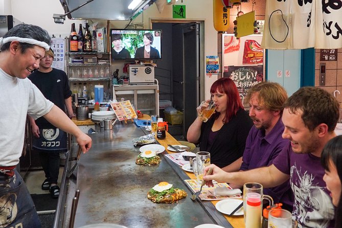 Hiroshima Izakaya Food and Drink Night Tour - Okonomimura: The Best Place to Start With Hiroshima’s Signature Dish