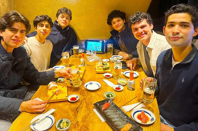 Tokyo: Shinjuku Bar Hopping & Night Walking Tour - Food and drink plan: gyoza, sushi, kushikatsu, and sake